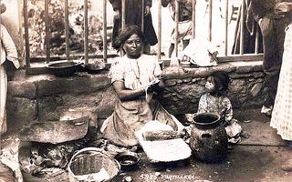 Woman and Child Making Tortillas Woman and Child Making Tortillas